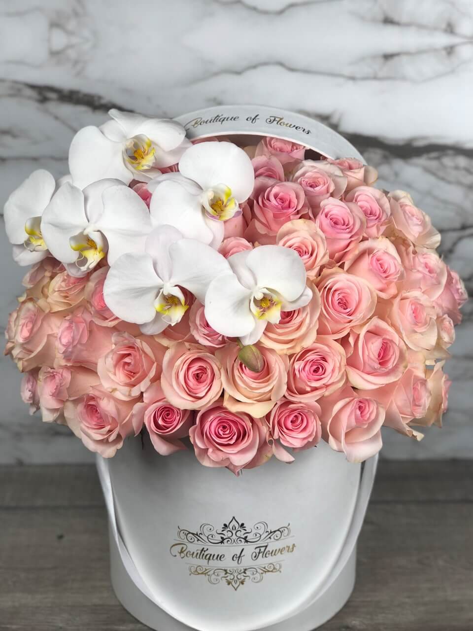 light pink rose with orchid round box